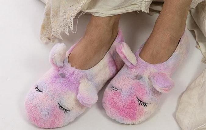 Woman wearing Magnolia Pearl pastel unicorn slippers, whimsical artisan vintage style shoes