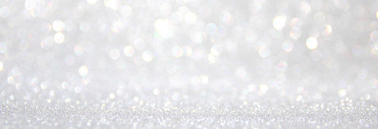 Pastel rainbow glitter bokeh background, soft and sparkly decorative abstract texture