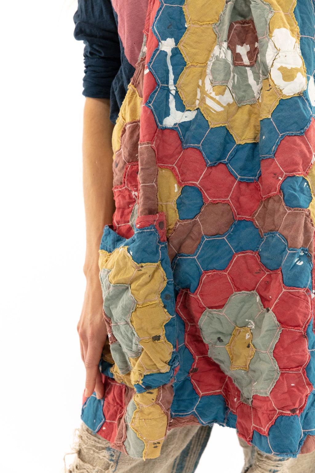 Woman in Magnolia Pearl artisan patchwork apron dress, vintage pants, whimsical boho style