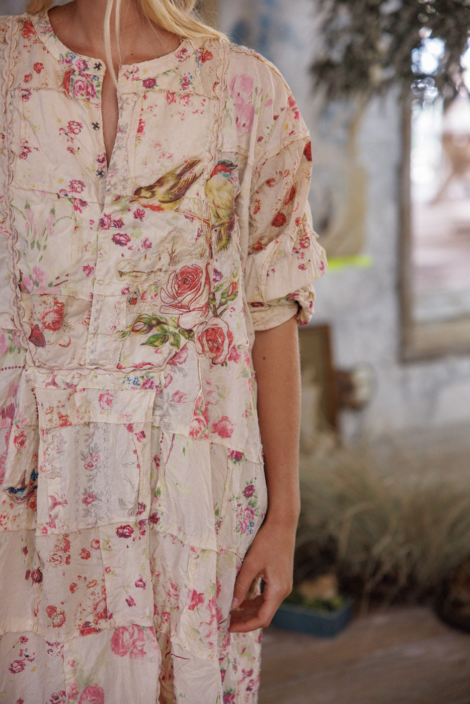 Magnolia Pearl artisan dress with vintage floral and bird print, whimsical patchwork design.