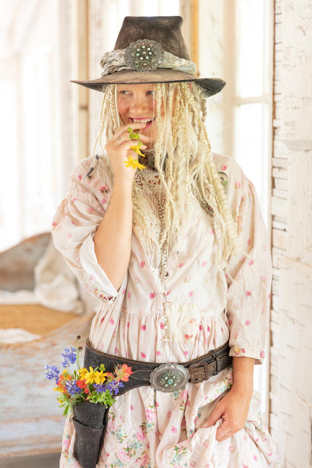 Magnolia Pearl artisan floral dress with whimsical belt, vintage style hat, and braided hair