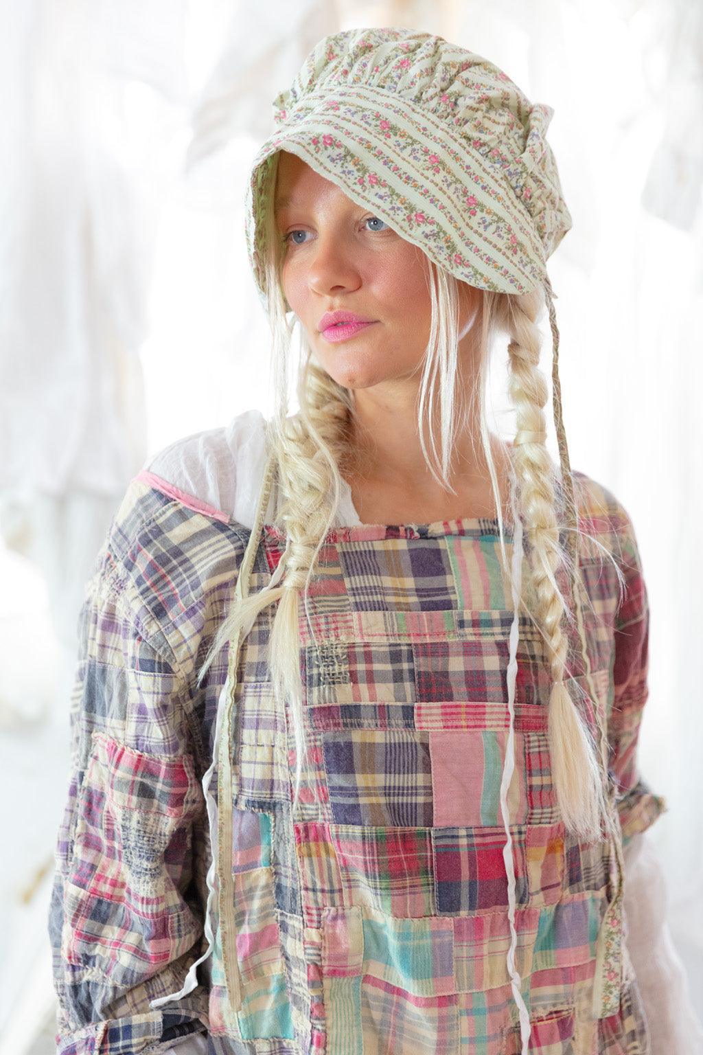 Woman in Magnolia Pearl artisan vintage patchwork dress, bonnet, boots, whimsical shabby decor