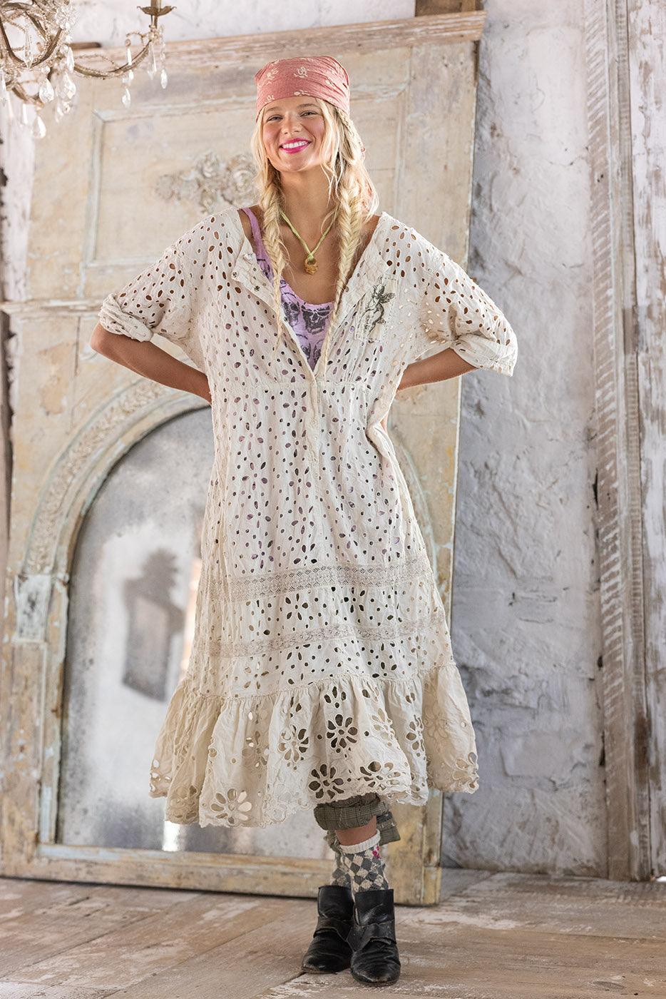 Woman in Magnolia Pearl artisan vintage lace dress, whimsical boho style, rustic setting