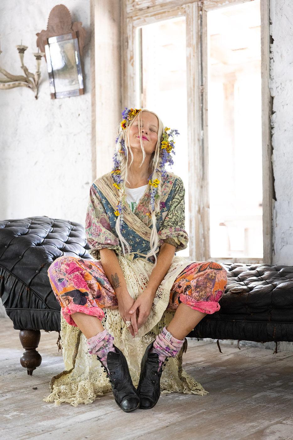 Woman in Magnolia Pearl artisan vintage clothing, whimsical floral designs, boho style decor