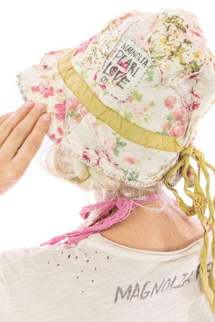 Magnolia Pearl floral patchwork bucket hat with vintage artisan style and whimsical design.