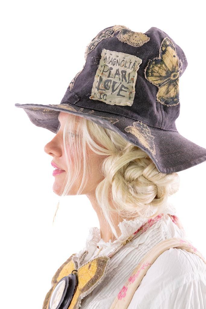 Magnolia Pearl whimsical artisan hat with vintage butterfly patches and unique handmade style