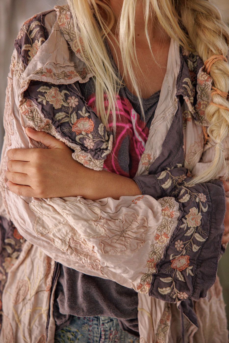 Magnolia Pearl artisan embroidered jacket with whimsical floral vintage design, worn by woman