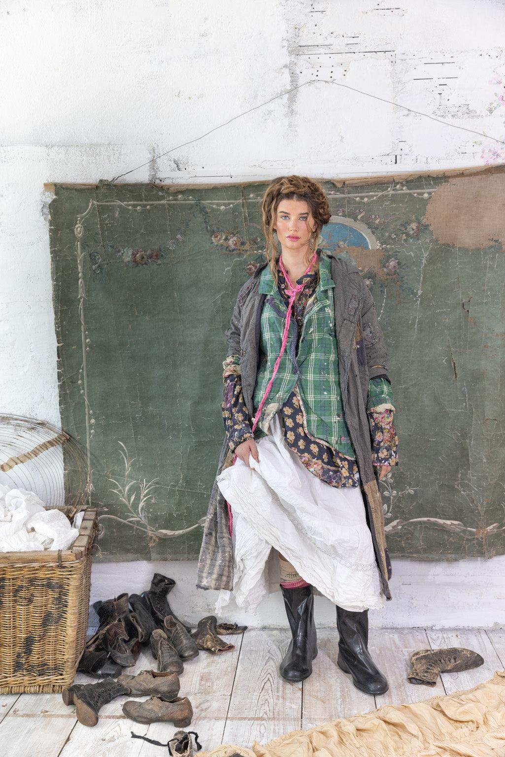 Woman in Magnolia Pearl artisan jacket, layered vintage dress, whimsical boho rustic style