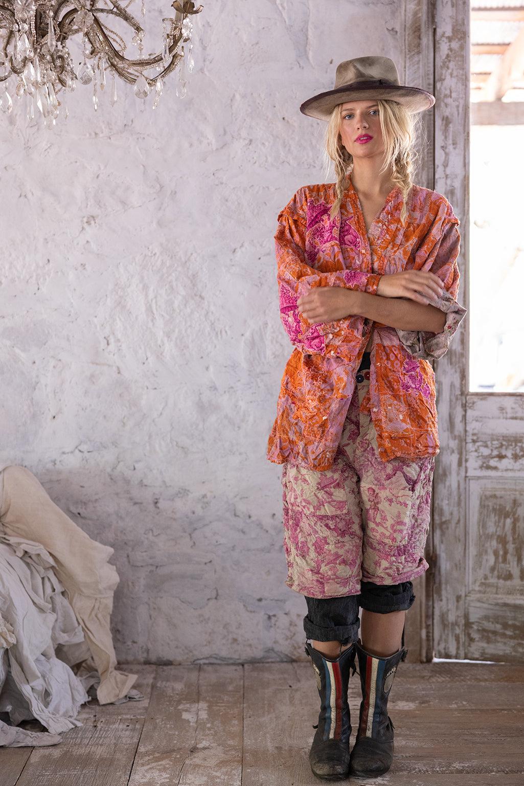 Woman in Magnolia Pearl artisan jacket and pants, vintage rustic room, whimsical style fashion