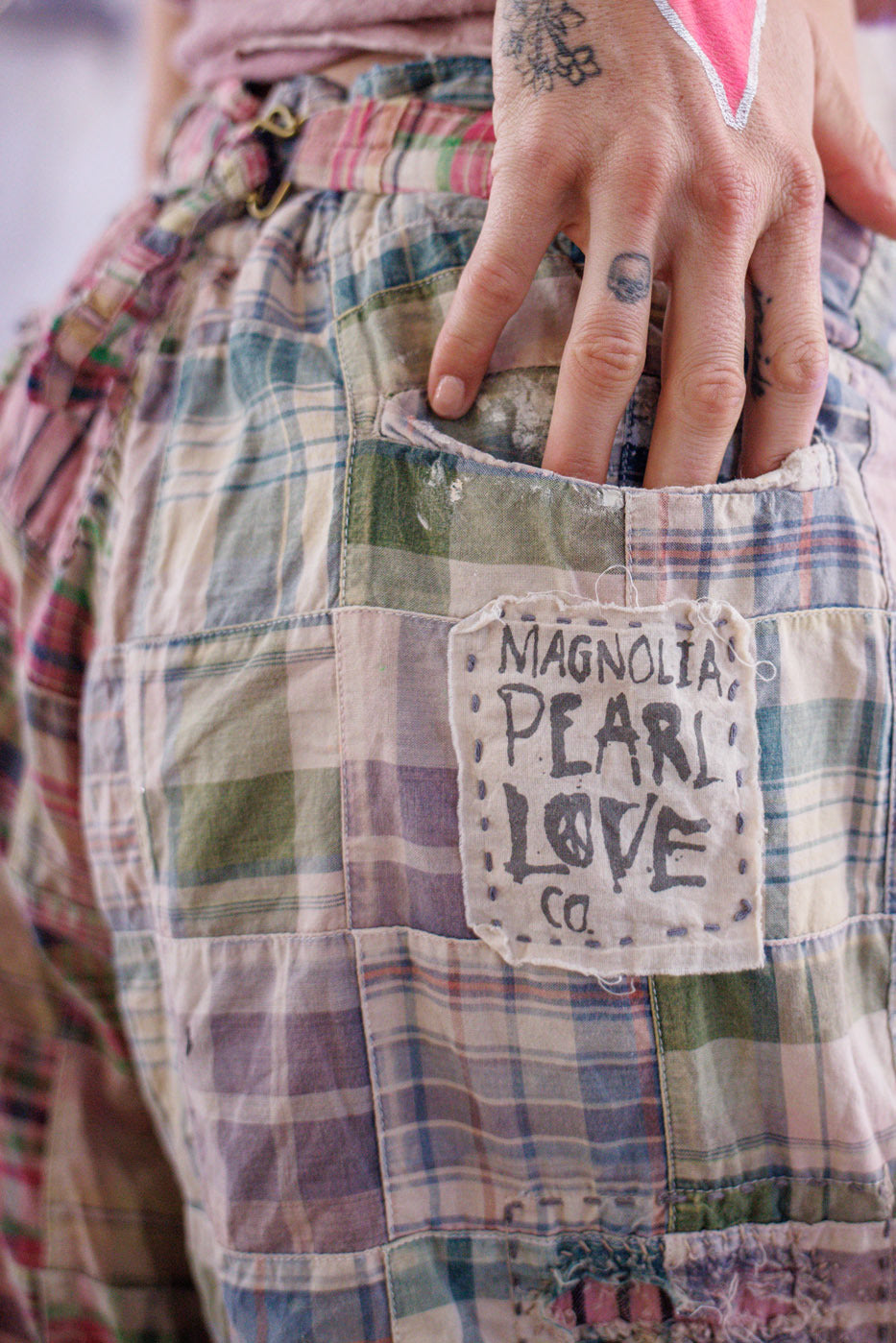 Magnolia Pearl artisan patchwork pants with vintage plaid, whimsical details, hand in pocket