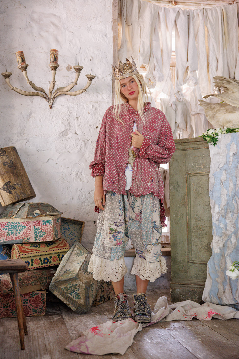 Magnolia Pearl artisan clothing, woman in whimsical vintage floral outfit and crown in rustic room