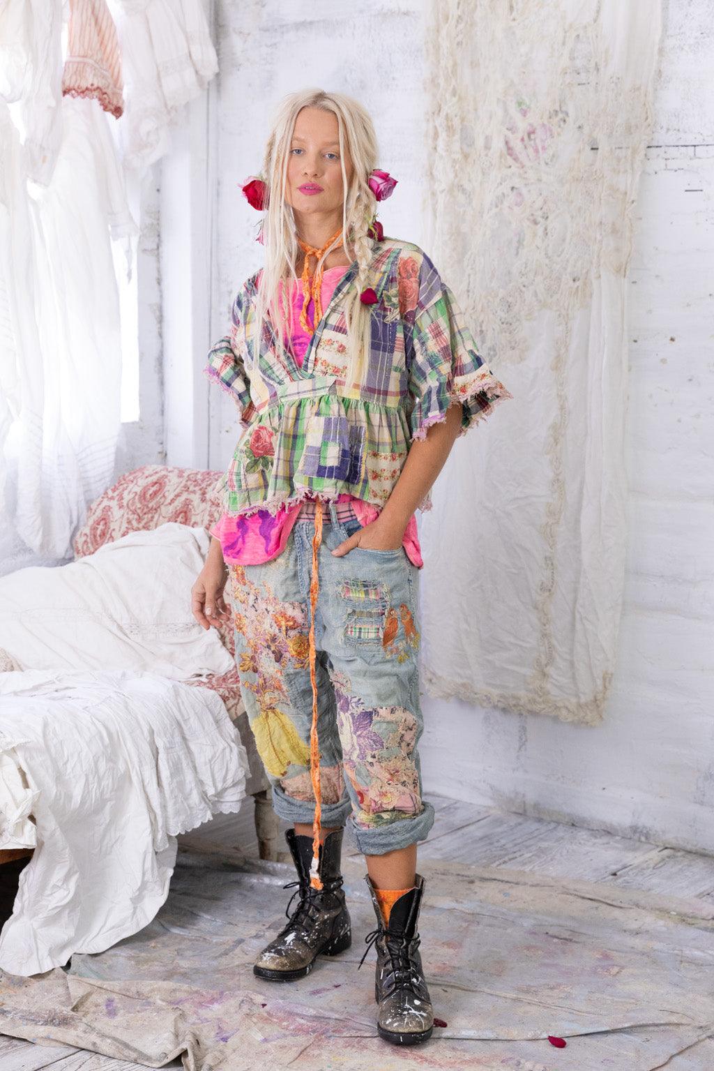 Woman in Magnolia Pearl artisan patchwork top and vintage embroidered jeans, whimsical style