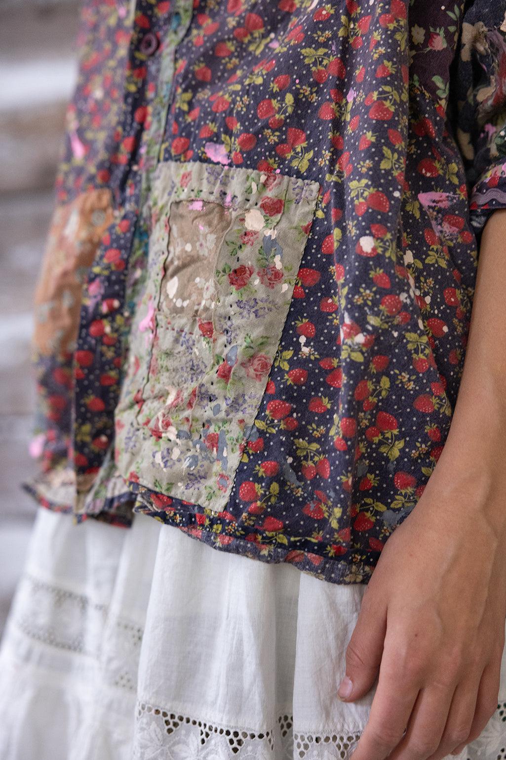 Magnolia Pearl artisan shirt with whimsical strawberry floral pattern and vintage patchwork over white lace skirt
