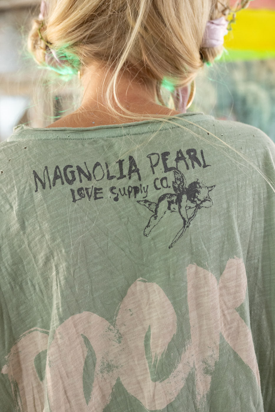Model in faded green AC/DC top – vintage rock look by Magnolia Pearl