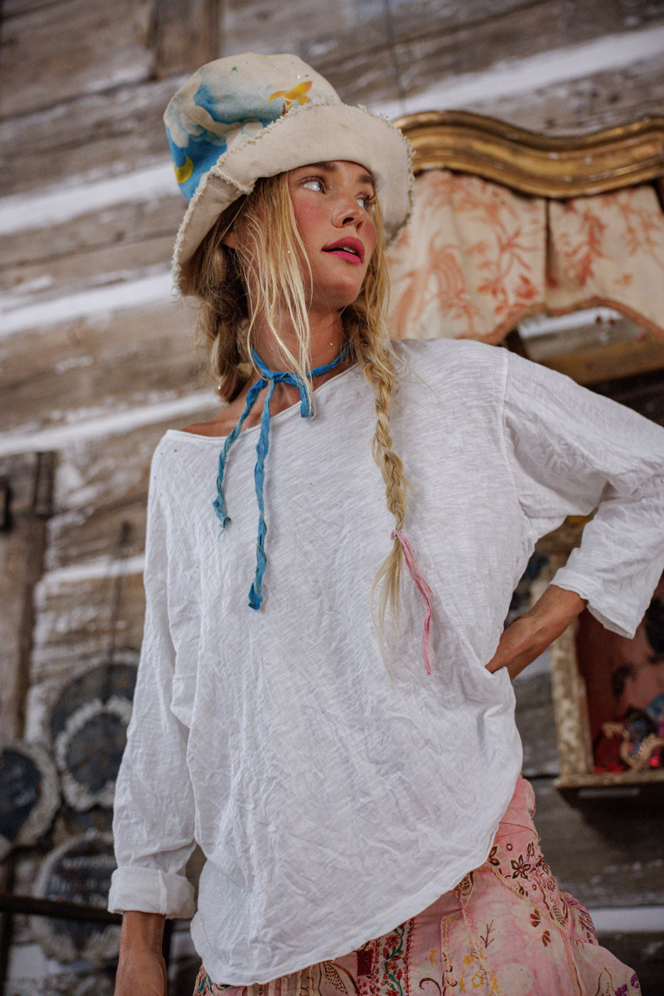 Woman in Magnolia Pearl artisan vintage blouse and whimsical hat, rustic boho style