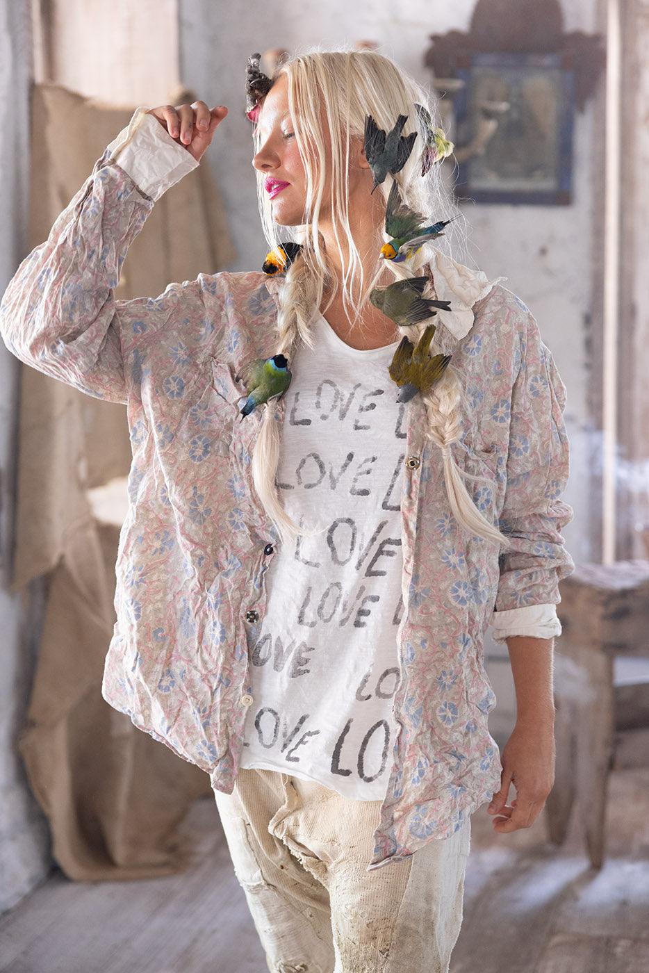 Magnolia Pearl model in vintage floral shirt, whimsical artisan LOVE graphic tee, birds in hair
