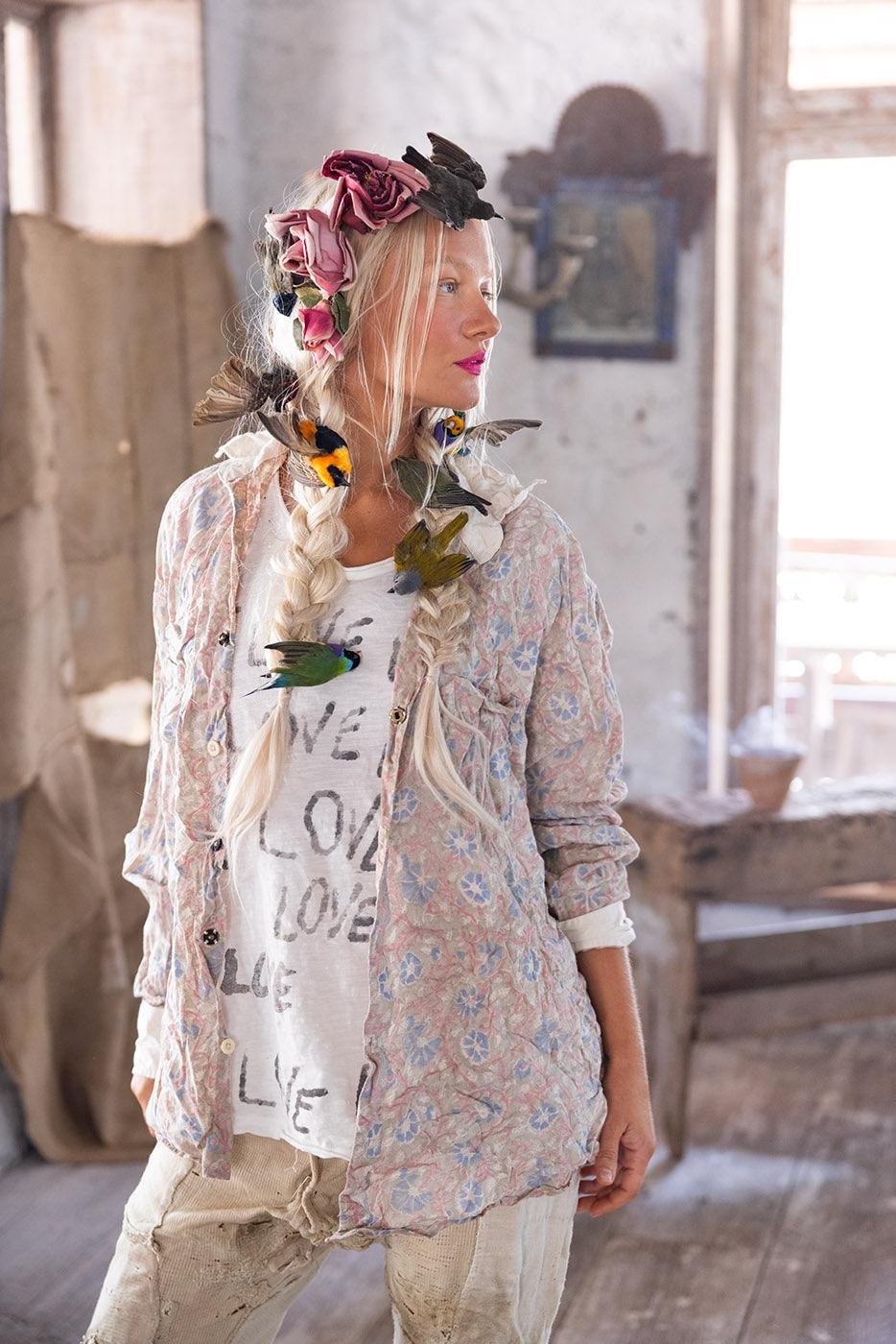 Magnolia Pearl model in vintage floral shirt, whimsical artisan LOVE graphic tee, birds in hair