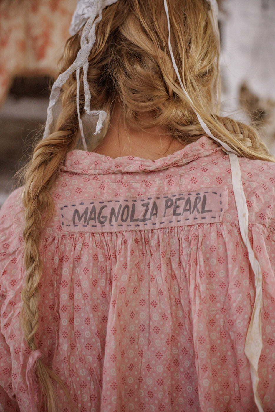 Magnolia Pearl artisan pink floral vintage top with whimsical design, braided hair, boho style