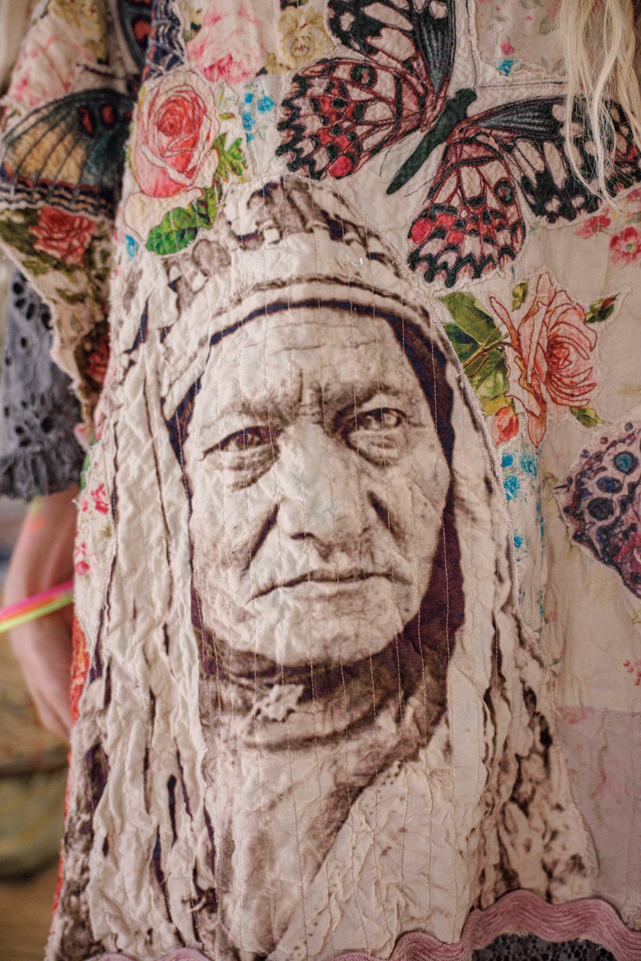 Magnolia Pearl artisan top with vintage-style Native portrait, butterflies, and floral designs