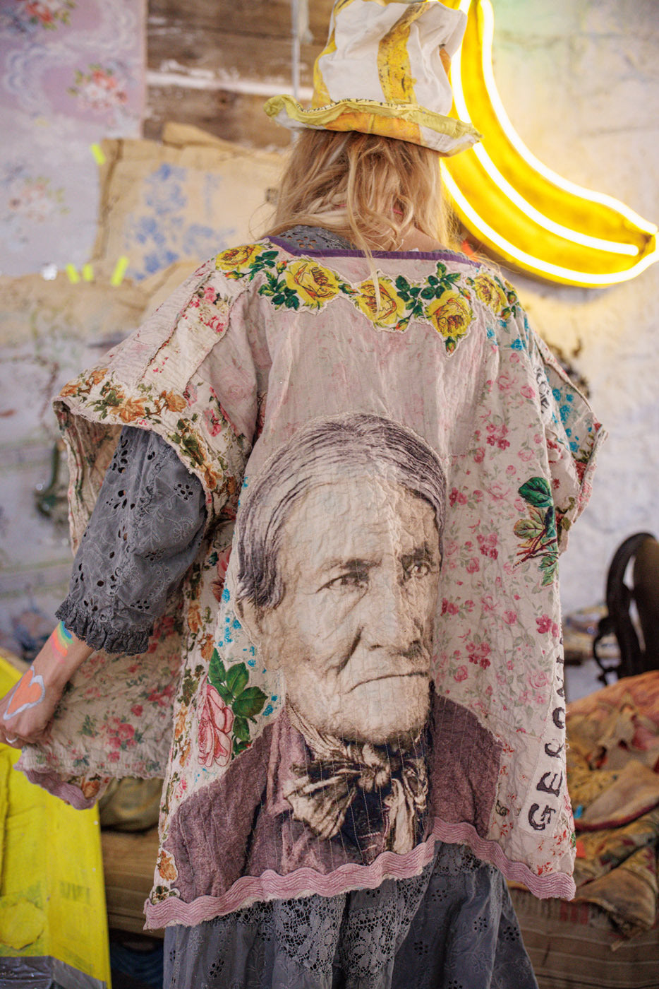 Magnolia Pearl model in vintage artisan floral jacket with portrait print, whimsical style, neon banana
