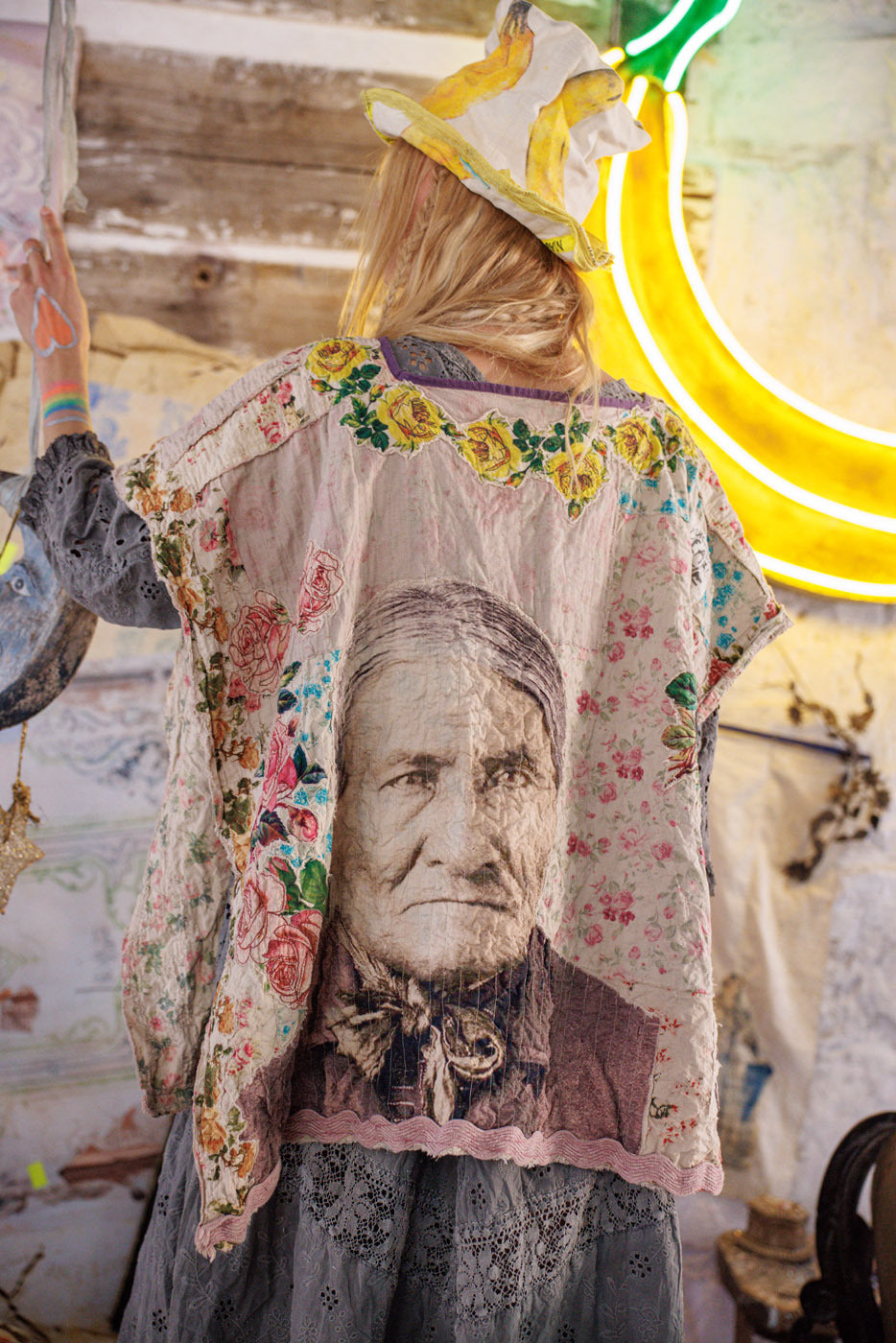 Magnolia Pearl artisan jacket with vintage portrait, floral details, and whimsical banana hat