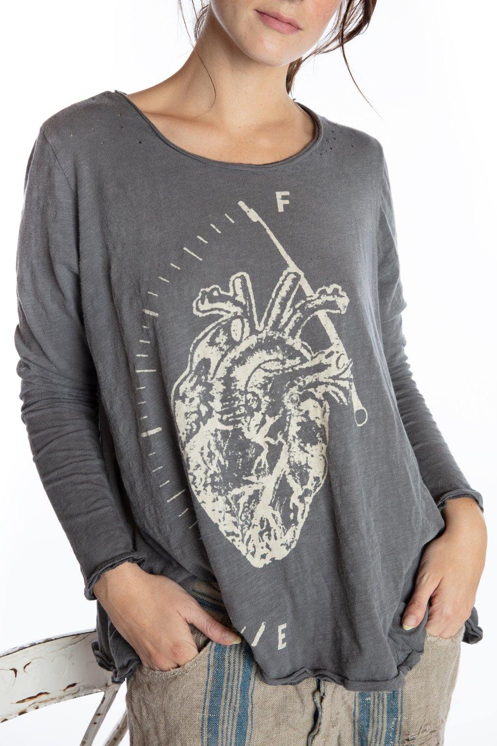 Magnolia Pearl vintage artisan gray shirt with whimsical anatomical heart print, worn by woman