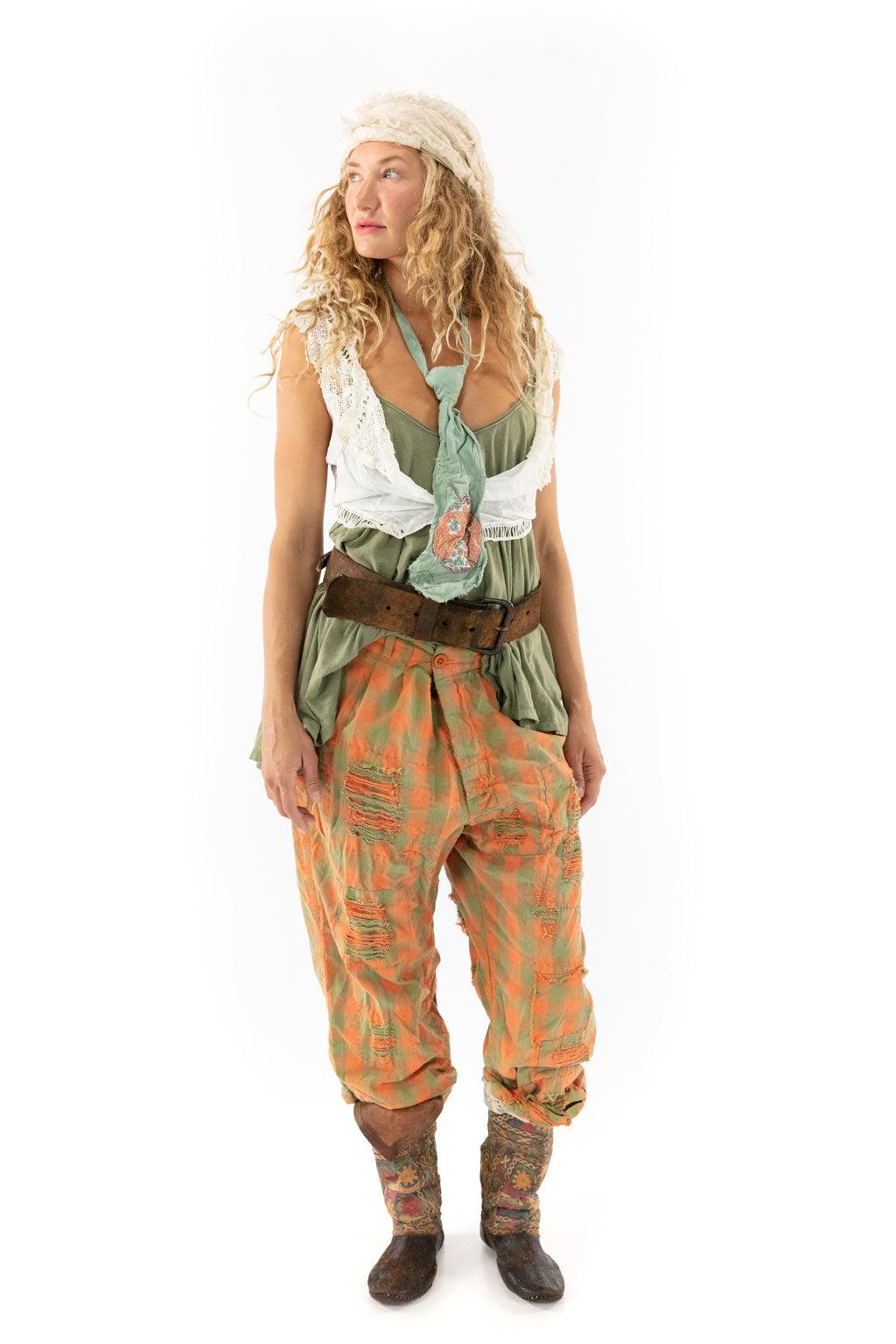 Woman models Magnolia Pearl artisan vintage pants, whimsical checked design, rustic style